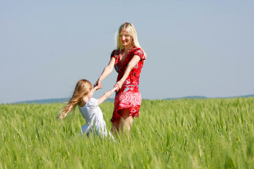 Fototapeta premium happy mother and daughter outdoors