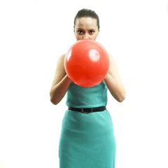 Deurstickers Young attractive girl inflating a balloon © Egor Mayer