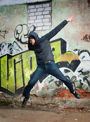 cool looking dancer posing on a grunge background