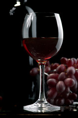 Red wine and grapes