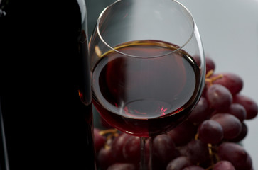 Red wine and grapes