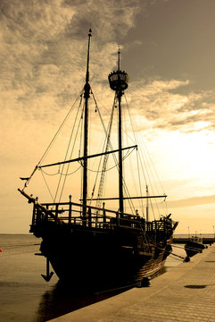 An old ship on a sea front, artistic version
