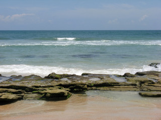 beach with rocks,sea and waves