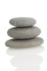balanced rocks on white