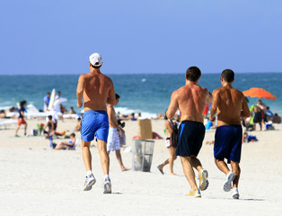 men jogging miami beach