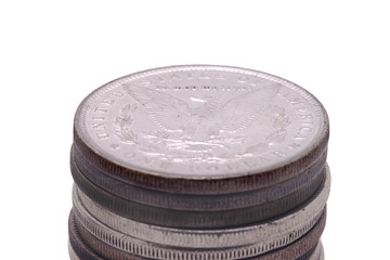 stack of US silver dollars tails up
