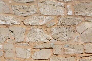 Stone Wall Background During the Bright Day
