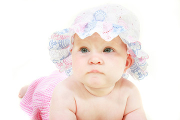 baby girl in hat portrait over white