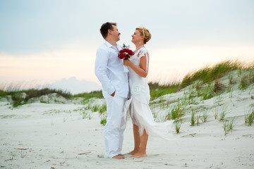 Just married couple looking happily at each other