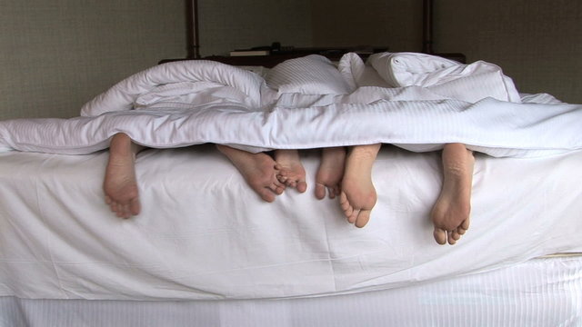 Family Feet in Bed