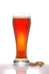 glass of beer and pistachio