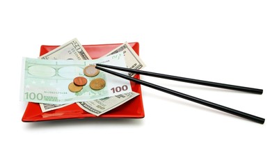 Money on red square plate with chopsticks isolated