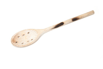 Wooden spoon isolated on a white studio background.