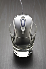 Computer mouse in a glass
