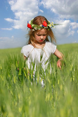 cute girl in green field portrait