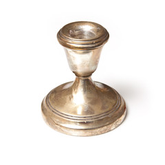 silver candle stick holder on a white studio background.