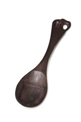 Wooden serving spoon isolated on a white studio background.