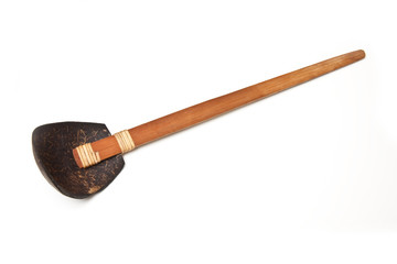 Wooden spoon isolated on a white studio background.