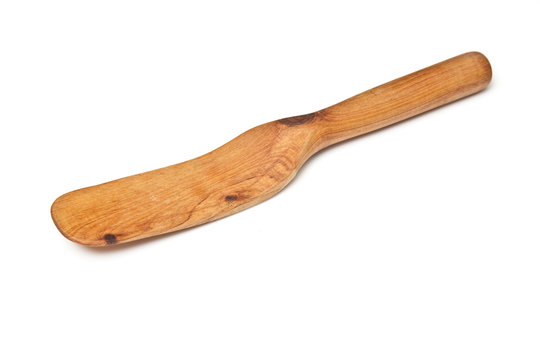Wooden spatular  isolated on a white studio background.