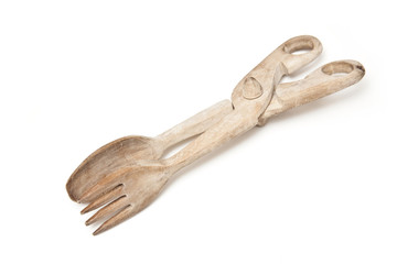 Wooden tongs isolated on a white studio background.