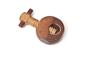 Wooden nut cracker isolated on a white studio background.