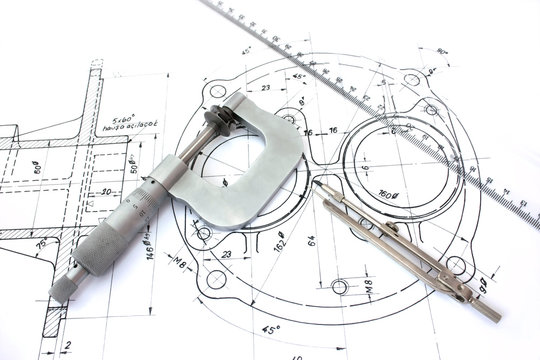 Micrometer compass and ruler on technical drawings