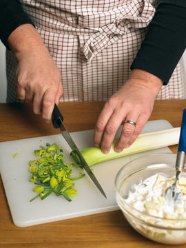 Chef cutting leek