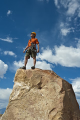 Rock climber nearing the summit.