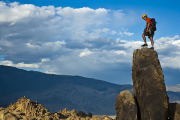 Rock climber nearing the summit.