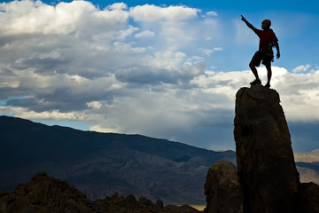 Rock climber nearing the summit.