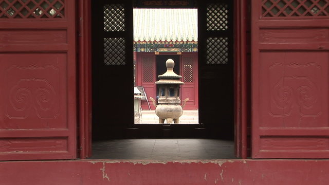 Incense burner through door, White Cloud Temple, China