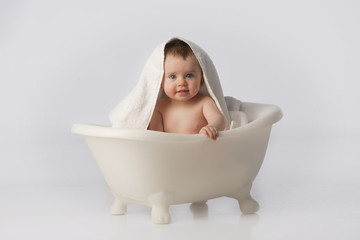 Boy in tub with towel