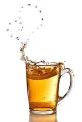 heart from bubbles of tea and with splash cup of tea