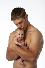 father holding daughter in hands on white