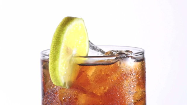 Cold glass of sparkling cola with lemon slice - HD