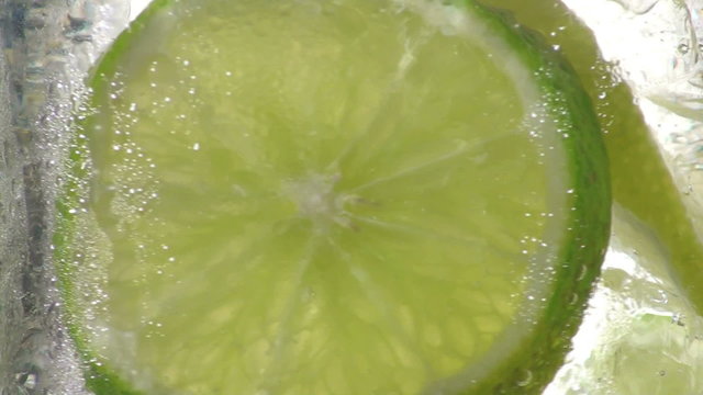 Ice cold soda with lemon and lime slices loop - HD