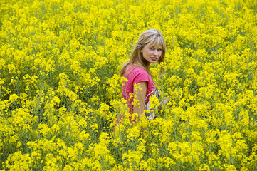 Naklejka na ściany i meble happy girl in yellow field