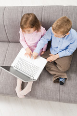 Children using laptop computer