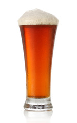 Cold glass of beer over white background