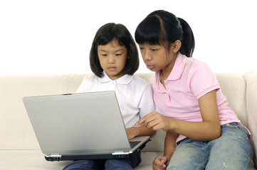 Kids using computer at home