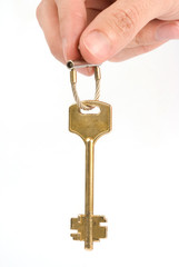 hand holds a gold key