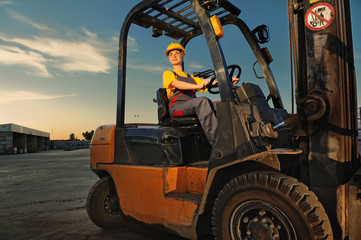 Female worker driving cargo truck