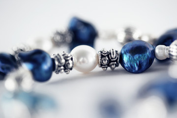 macro of blue necklace with pearls