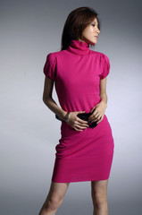 model posed on light background in nice dress