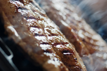 Close-up of cooking steak in the kitchen