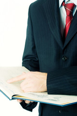 Young business man with a notebook in his hands
