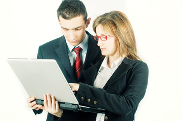 Fototapeta na wymiar Young business man and woman with laptop