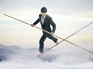 Businessman running a tightrope