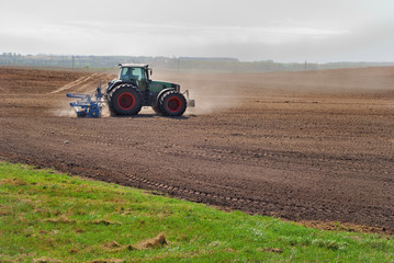 Obraz premium Ploughing tractor