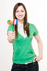 Smiling girl with lollipops